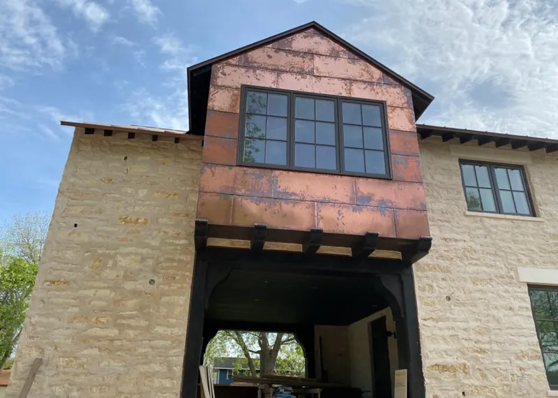 Copper metal panel facade on a stone building for Skylight Installation in Meridianville